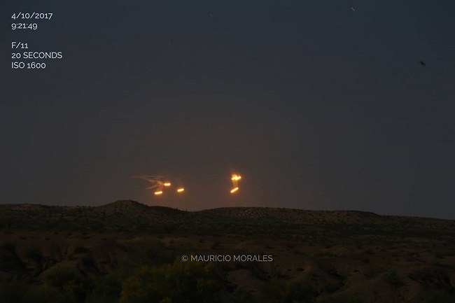 Bright orange lights hovered for 15 minutes